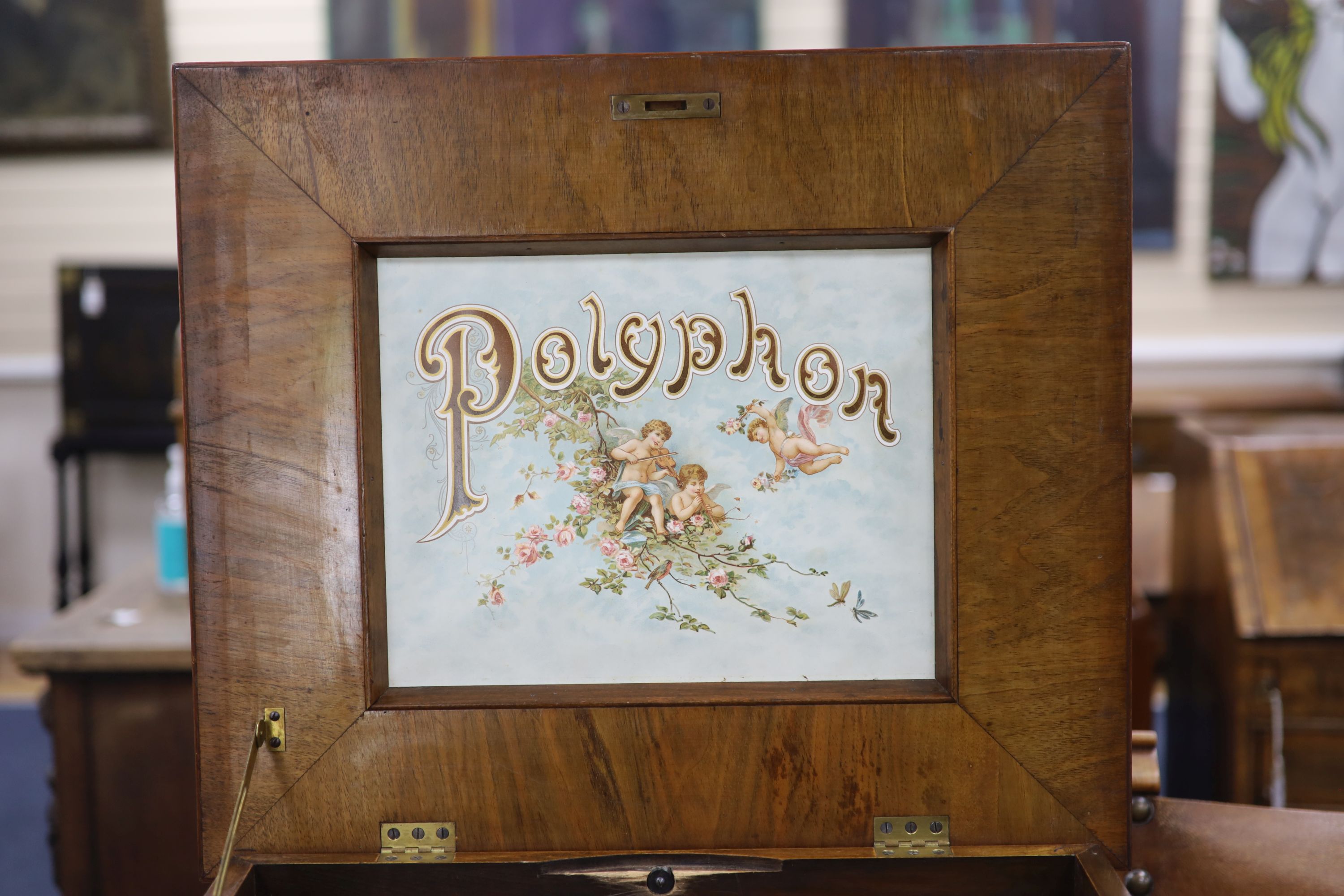 A large Polyphon walnut table top musical box, playing thirty 39.5cm discs